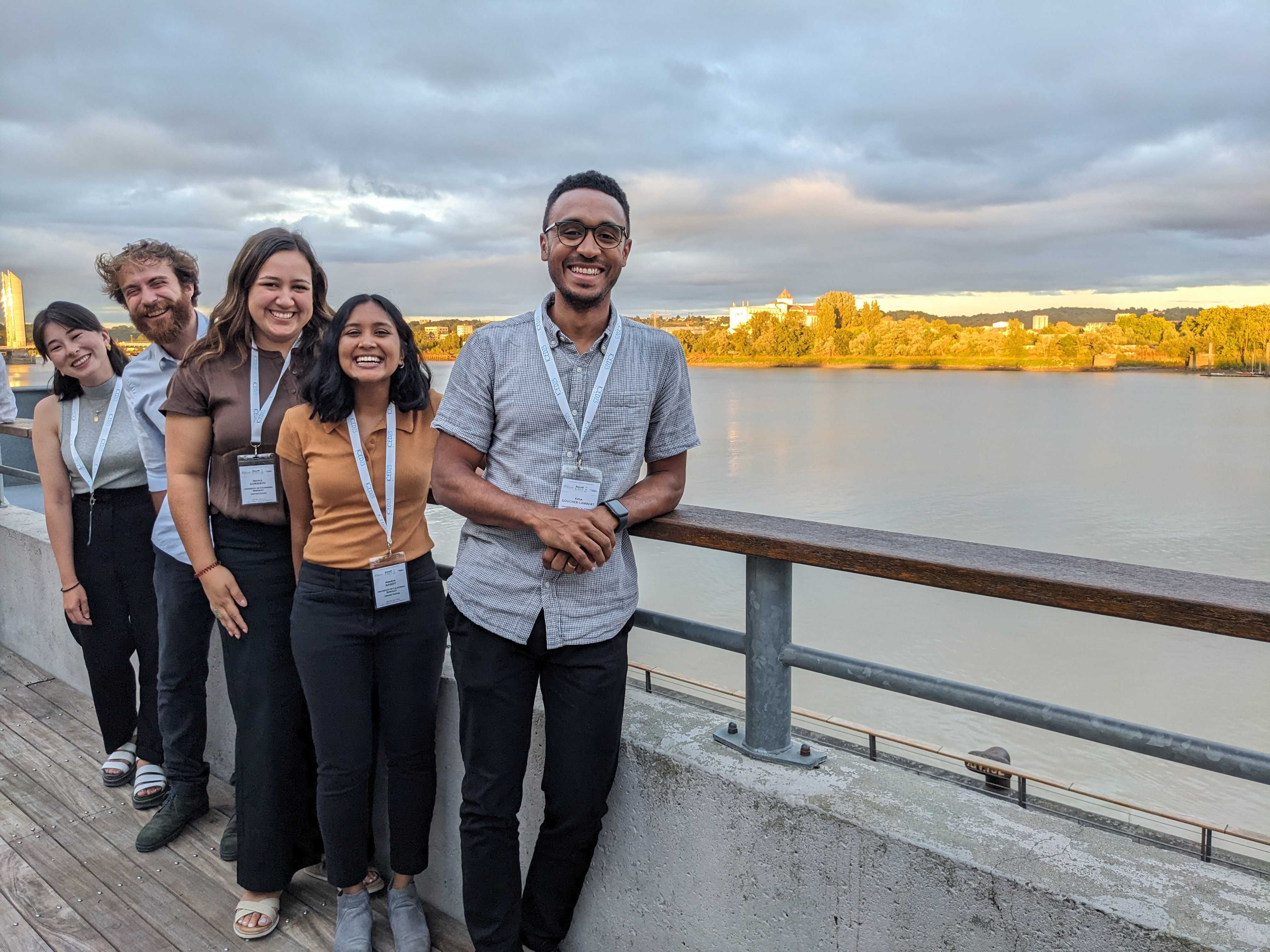 from left to right, Elisa, Samuele, Nicole, me (Ananya), and Kosa in front of railing with Garonne river in the background